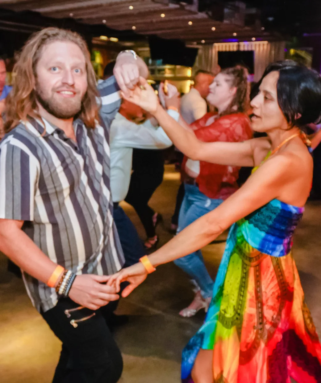 Vera leading a dance at a Vedanza social