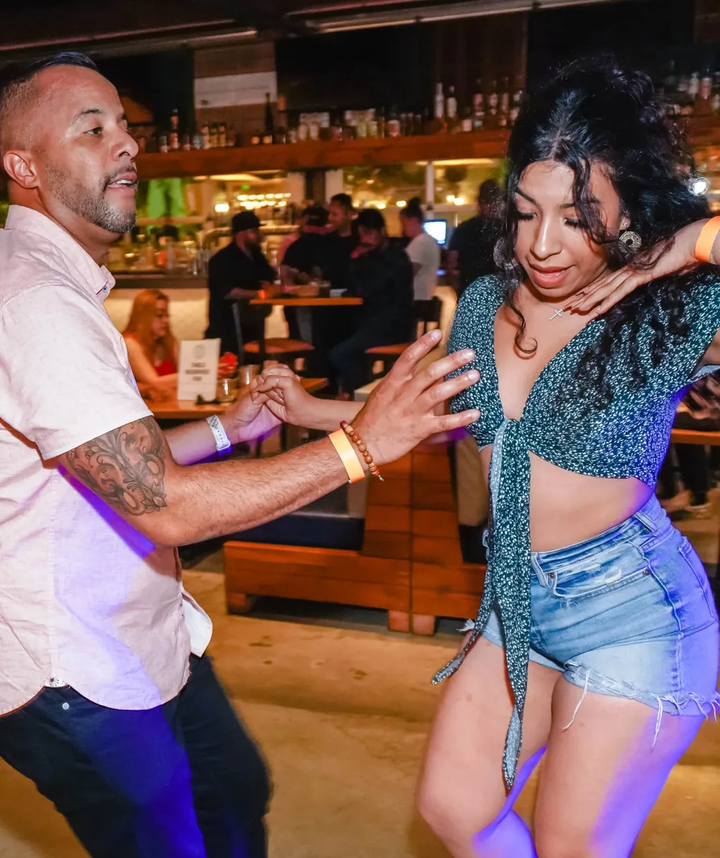 Adults dancing salsa together